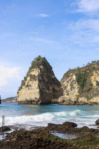 The beautiful Diamond Beach on Nusa Penida Island, Bali, Indonesia. Amazing  view, white sand beach with rocky mountains and azure lagoon with clear water of Indian Ocean  © Yaroslav