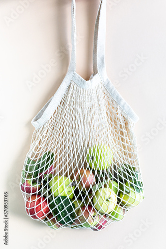 Fresh Apples in a Shopping Bag Mesh. Zero waste, Organic harvest concept.