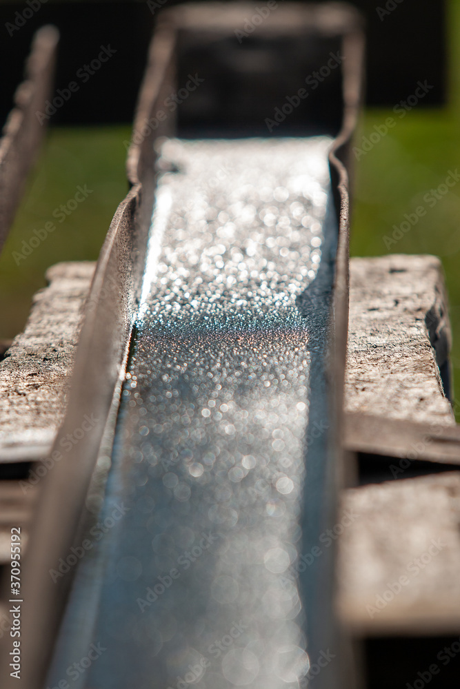 wet rusty channel on a wooden workbench
wet rusty channel on a wooden workbench
