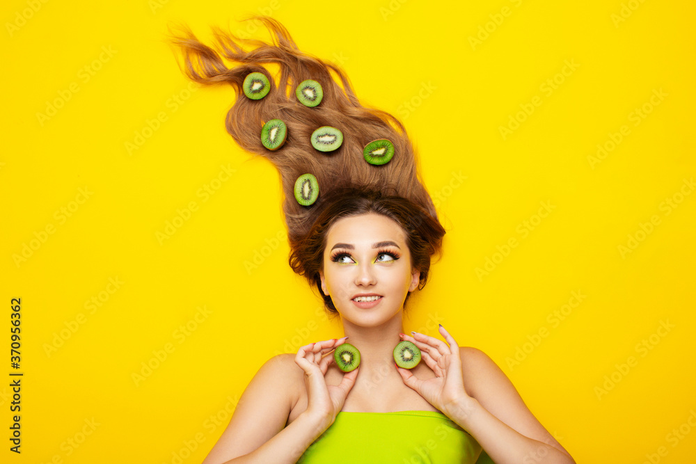 fashion portrait of beautiful girl lying on colored background with ...