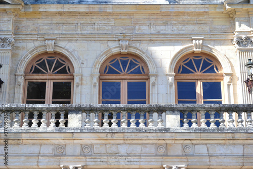 Close Up of Arched Windows & Balustrade on Stone Old French Public Building 13627-2185-005 photo