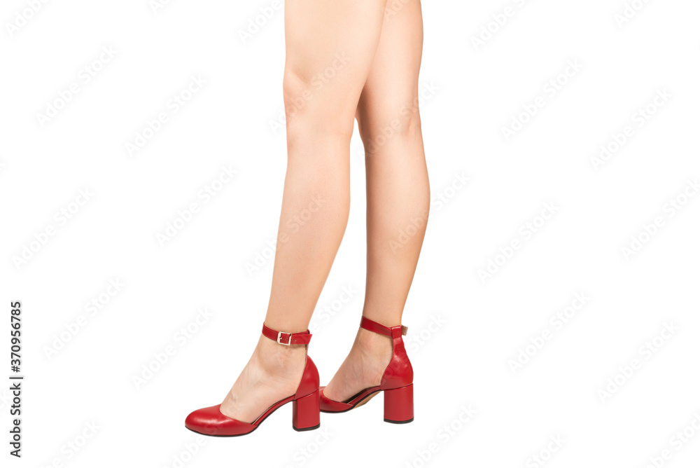 Woman legs in retro red sandals on heels. Woman legs in retro red sandals on heels.