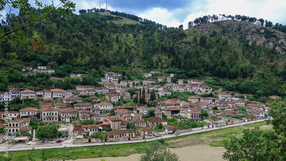 Old historical white buildings in green mountain slope. Berat old town, Albania