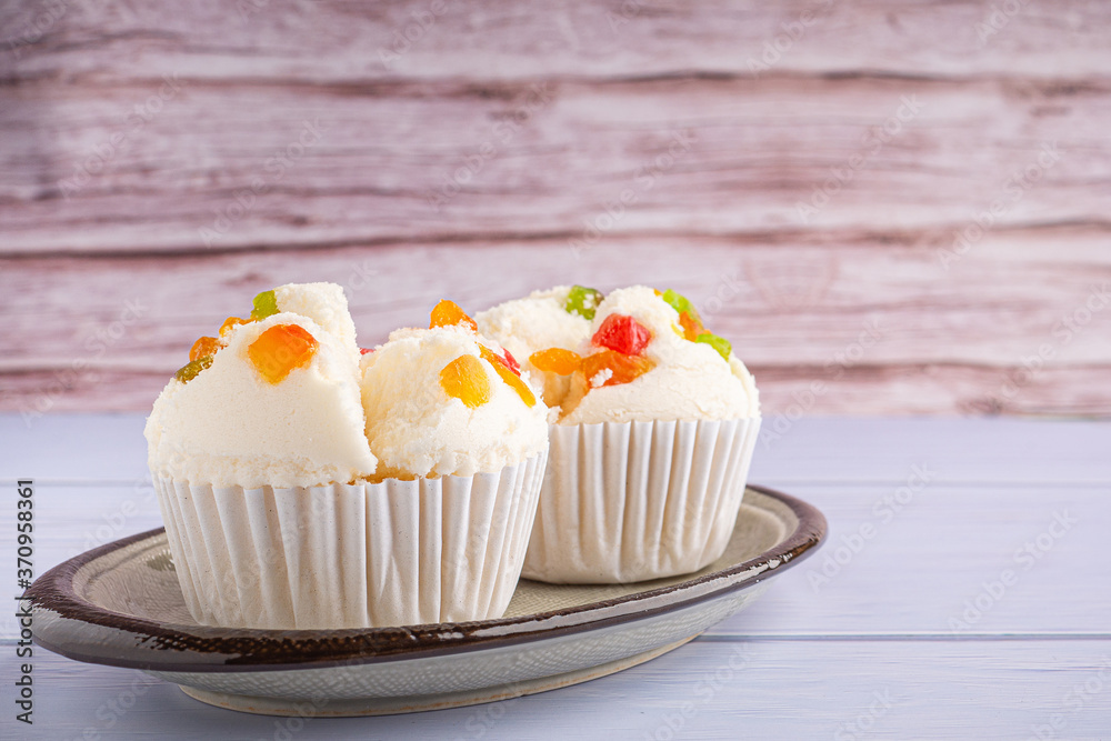 Thai steamed cupcakes topped with dry fruit on plate Thai steamed cupcakes topped with dry fruit on plate
