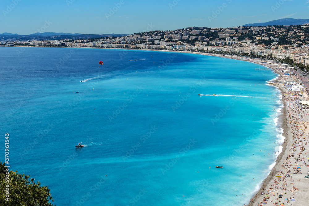 Wonderful panoramic view of Nice with colorful historical houses, seacoast and sea from Cimiez hill. Nice - luxury resort of Cote d'Azur, France.