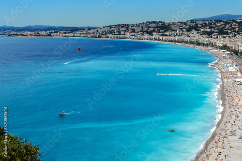 Wonderful panoramic view of Nice with colorful historical houses, seacoast and sea from Cimiez hill. Nice - luxury resort of Cote d'Azur, France. © dbrnjhrj