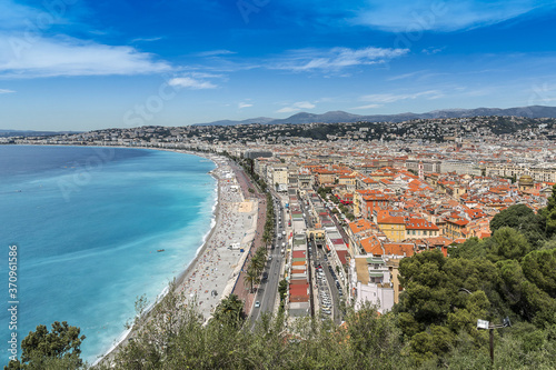 Wonderful panoramic view of Nice with colorful historical houses, seacoast and sea from Cimiez hill. Nice - luxury resort of Cote d'Azur, France.