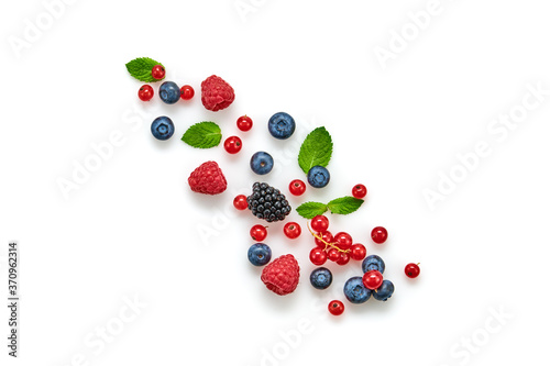 Blueberry, raspberry, blackberry, redcurrant isolated on white. Fresh blueberry, berries mix closeup. Red raspberry, mint creative composition. Colorful trendy concept, top view.