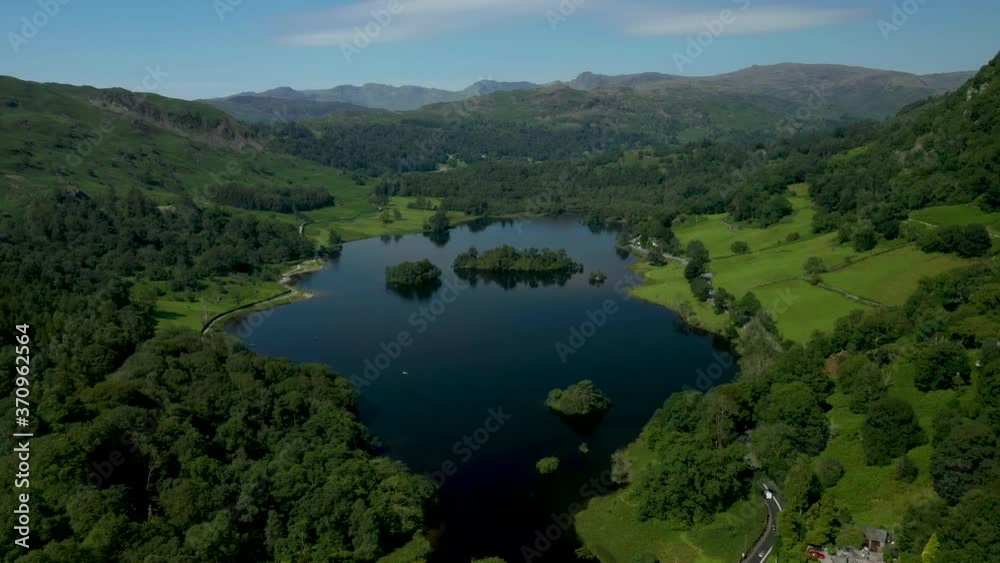 4K: Drone Aerial Clip of Rydal Water Lake in the English Lake District, Cumbria, UK. Approach shot in Summer with Blue Sky. Stock Video Clip Footage 4K: Drone Aerial Clip of Rydal Water Lake in the English Lake District, Cumbria, UK. Approach shot in Summer with Blue Sky. Stock Video Clip Footage