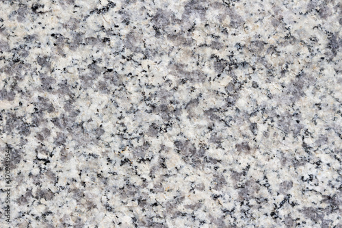 Granite texture with black and gray splashes.