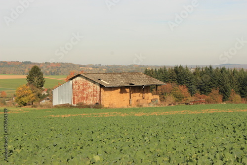 Farm house view from countryside field