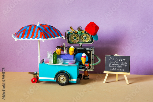 Ice cream mobile cart. Summer shop with big umbrella. Funny robot shopman sell ice cream and cold lemonade drinks. Green background. copy space black chalkboard menu © besjunior