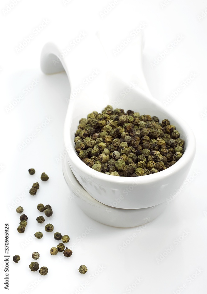 Green Peppercorn, piper nignum, Green Berries against White Background Green Peppercorn, piper nignum, Green Berries against White Background