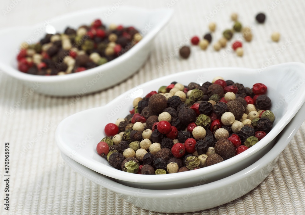 Five Peppercorns, piper nigrum, Black, Green, White, Pink and Jamaica Pepper, Berries against White Background Five Peppercorns, piper nigrum, Black, Green, White, Pink and Jamaica Pepper, Berries against White Background