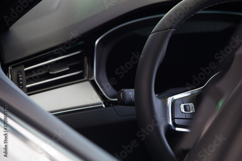 view of the steering wheel and car dashboard through the window © Ruslan