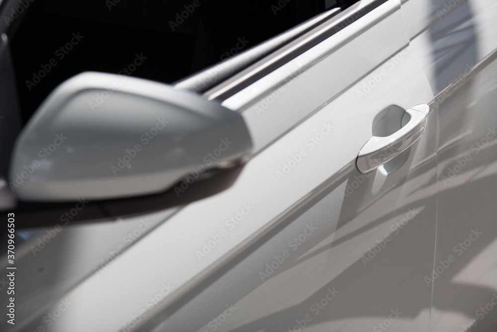 Fototapeta premium view of the side doors of a white car