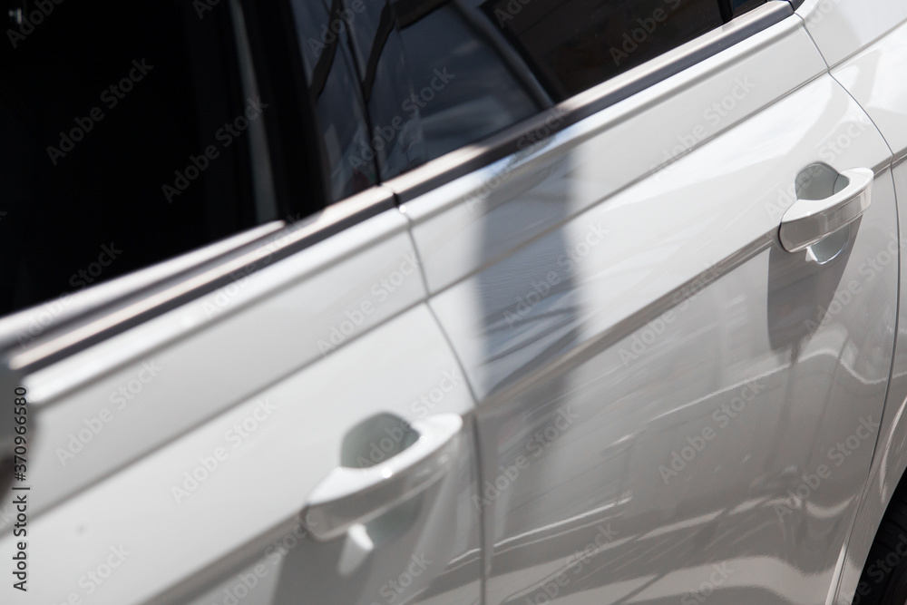 view of the side doors of a white car