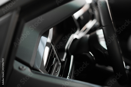view of the steering wheel and car dashboard