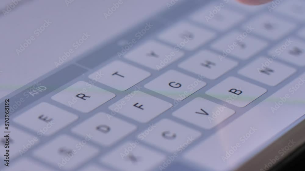 Texting on a Touch Screen Tablet Close Up Texting on a Touch Screen Tablet Close Up