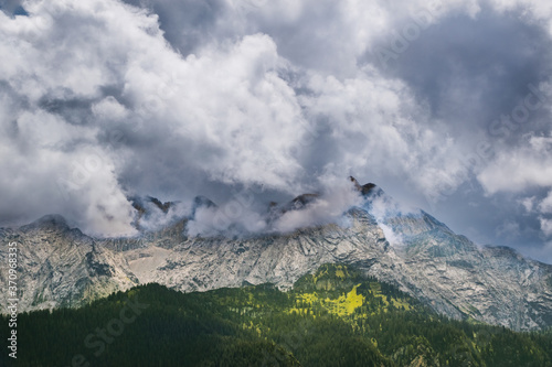 dark storm clouds over the mountains © Toms.media