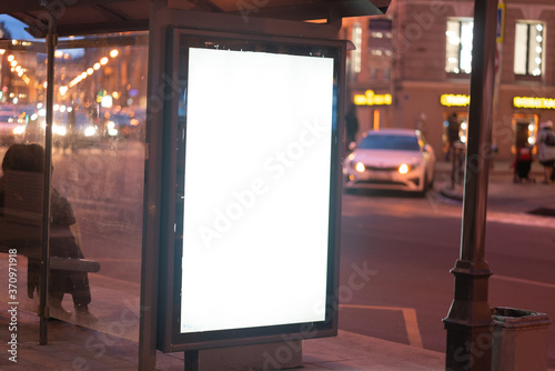Blank Banner light box Mockup Media Advertising. In the city on the street in the evening