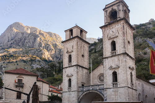 Obraz na płótnie Medieval church with towers in Kotor (Montenegro) in mountains. Architectural decorations of buildings- columns, tops, gypsum stucco molding. w salonie