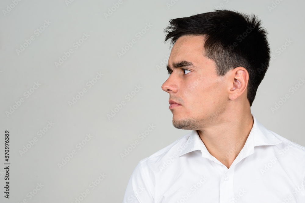 Obraz premium Portrait of handsome businessman against white background