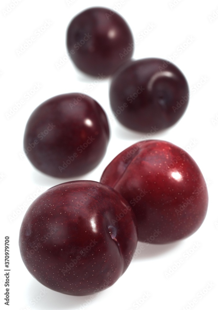 Red Plums, Fruits against White Background Red Plums, Fruits against White Background