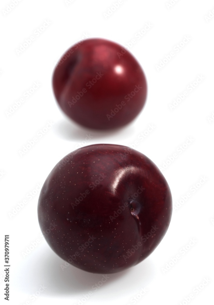 Red Plums, Fruits against White Background Red Plums, Fruits against White Background