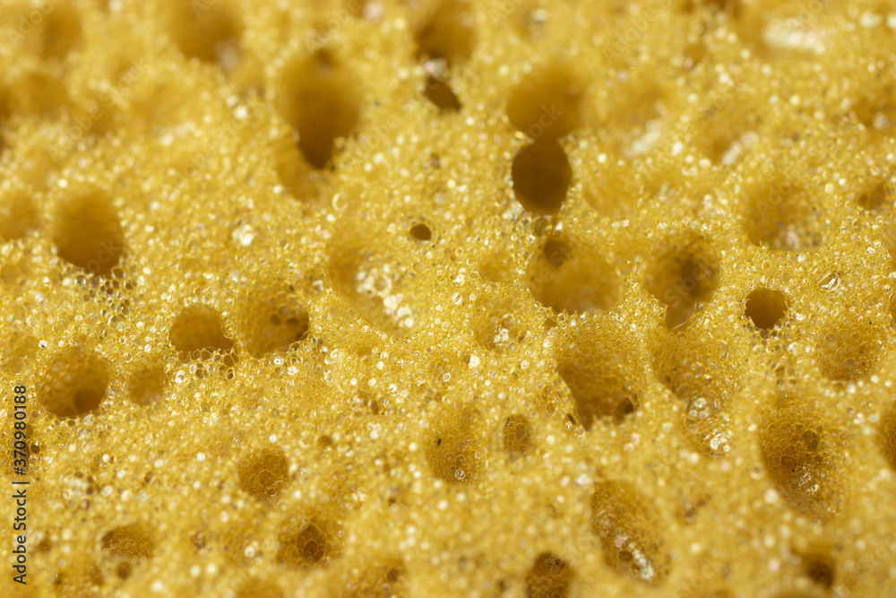 Yellow sponge perforated texture background Yellow sponge perforated texture background