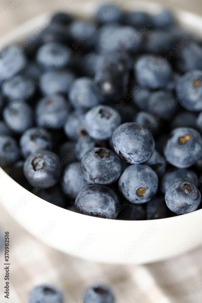 Selective focus. Macro. Blueberries in a bowl. Fresh blueberries with a bloom. Selective focus. Macro. Blueberries in a bowl. Fresh blueberries with a bloom.