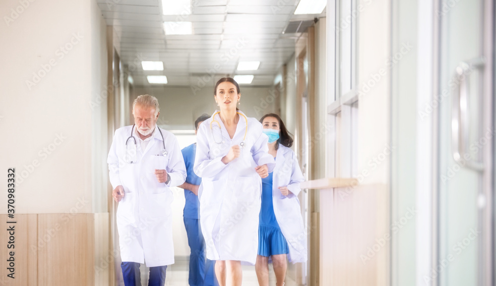 Motion blur background group of doctor and medical team running rushing to the rescue center hallway in hospital. emergency to saving patient life. health care concept Motion blur background group of doctor and medical team running rushing to the rescue center hallway in hospital. emergency to saving patient life. health care concept