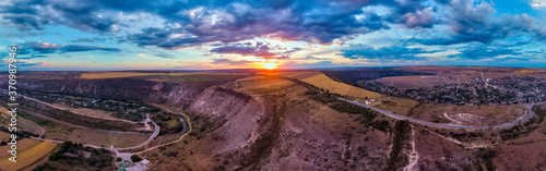 Aerial drone view of Orheiul Vechi village panorama in Moldova at sunset © frimufilms