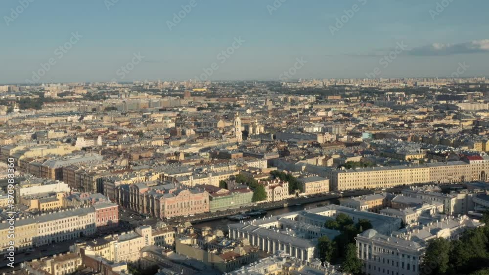 City buildings in Europe, Saint Petersburg drone shot under bright sky in summer. Zoom in fly over the tops of the buildings in a beautiful european city City buildings in Europe, Saint Petersburg drone shot under bright sky in summer. Zoom in fly over the tops of the buildings in a beautiful european city