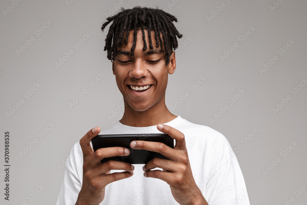 Portrait of a young african man dressed in plaid shirt Portrait of a young african man dressed in plaid shirt