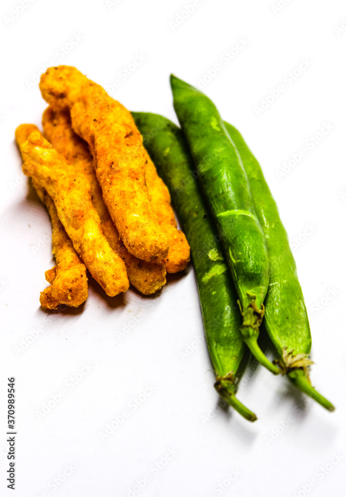 A picture of kurkure and pea on white background A picture of kurkure and pea on white background