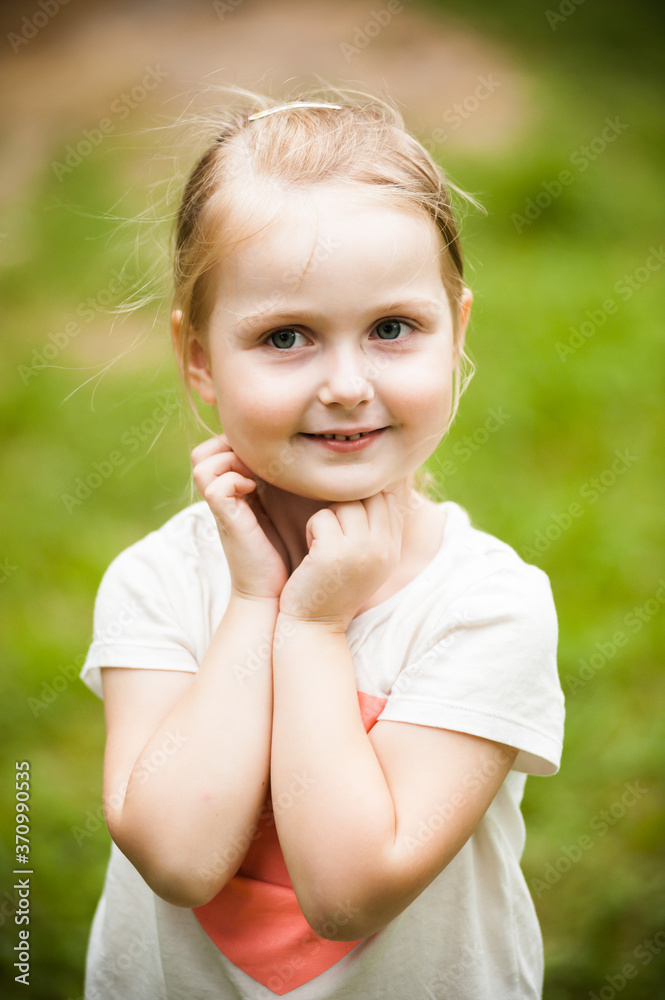 Portrait of a cheerful girl in the summer Portrait of a cheerful girl in the summer