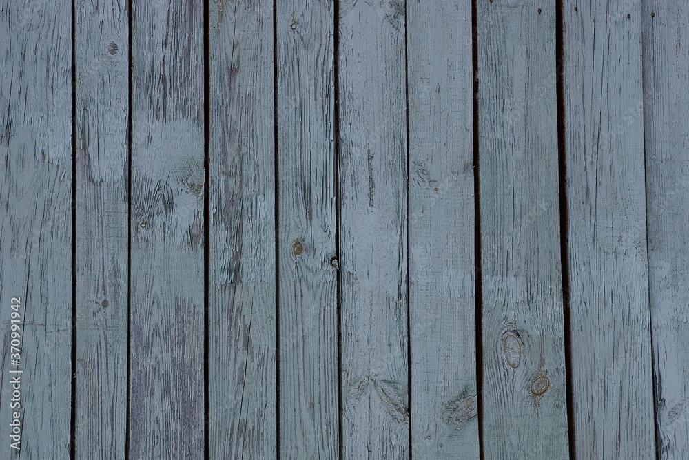 Fototapeta premium wooden texture from gray boards in the fence wall on the street