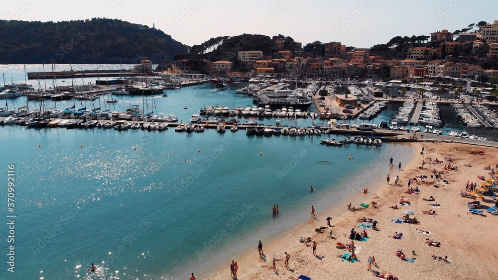 Bird view of the crowded beach of tourists in Port Soller, Mallorca. High quality photo