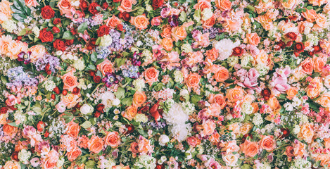 Beautiful floral wall background with fresh rose and flower bouquet pattern. Vintage wedding decoration banner.