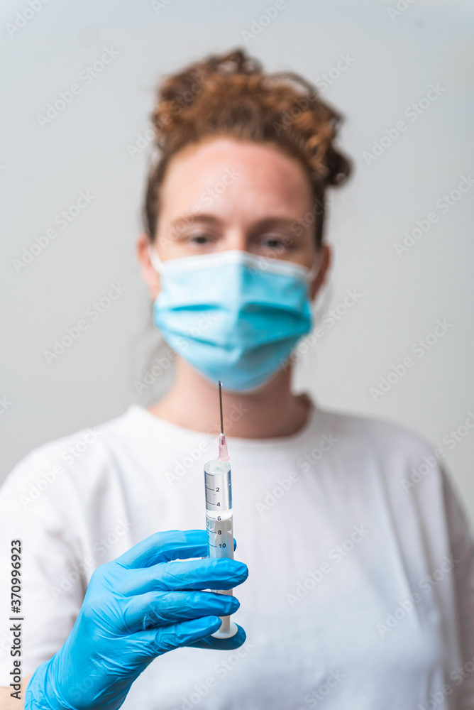 Portrait of medical worker preparing injection with Corona virus vaccine Portrait of medical worker preparing injection with Corona virus vaccine