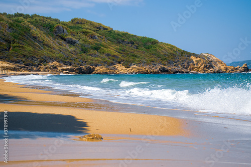 Fototapeta Naklejka Na Ścianę i Meble -  remote beach on the Mediterranean sea in Greece, with azure water and white waves