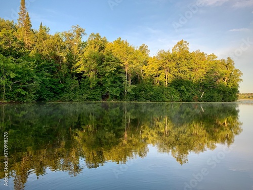 Minnesota changing trees reflecting in lake 