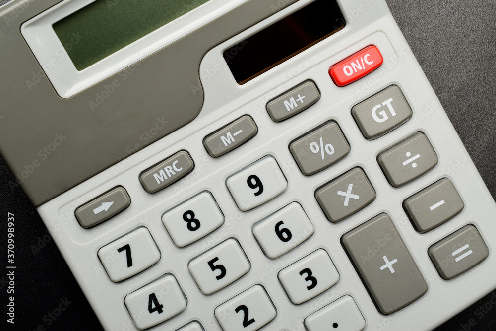 top view of calculator on black background. top view of calculator on black background.