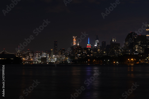 Dark Nighttime Roosevelt Island and Manhattan Skyline along the East River in New York City © James