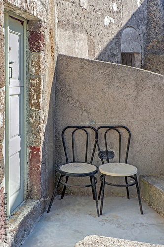 Two chairs on the terrace of Emporio, Santorini, Greece © havoc