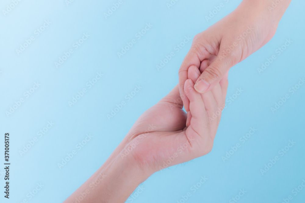 Helping hand or International day of peace concept. Two hands, helping arm of a friend, teamwork. Helping hand or International day of peace concept. Two hands, helping arm of a friend, teamwork.