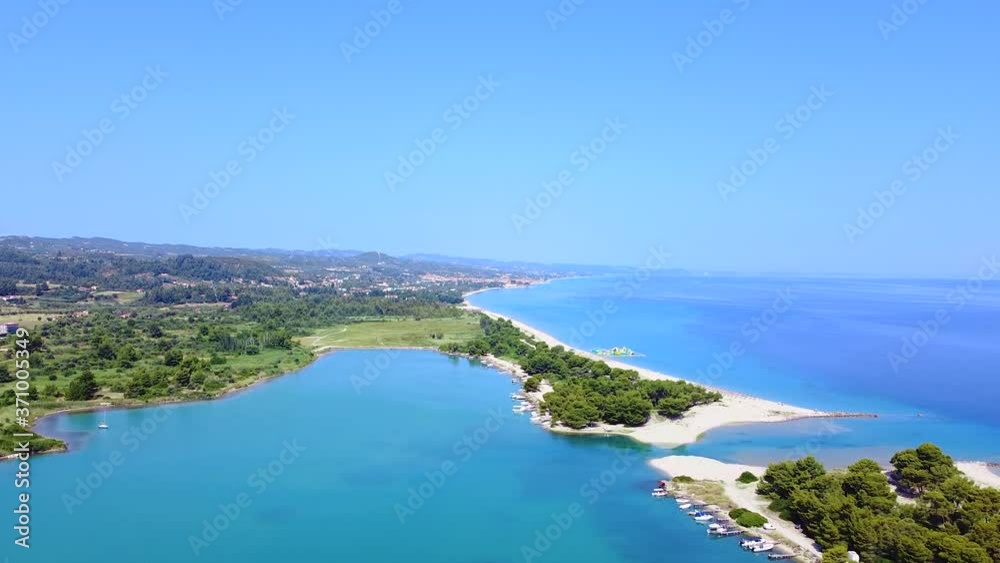 Aerial view of amazing blue lagoon for docking boats with small passage between to sand beaches