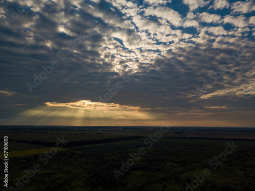 Aerial view. Sunset over Ukrainian agricultural fields. © Sergey