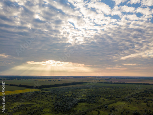 Aerial view. Sunset over Ukrainian agricultural fields.